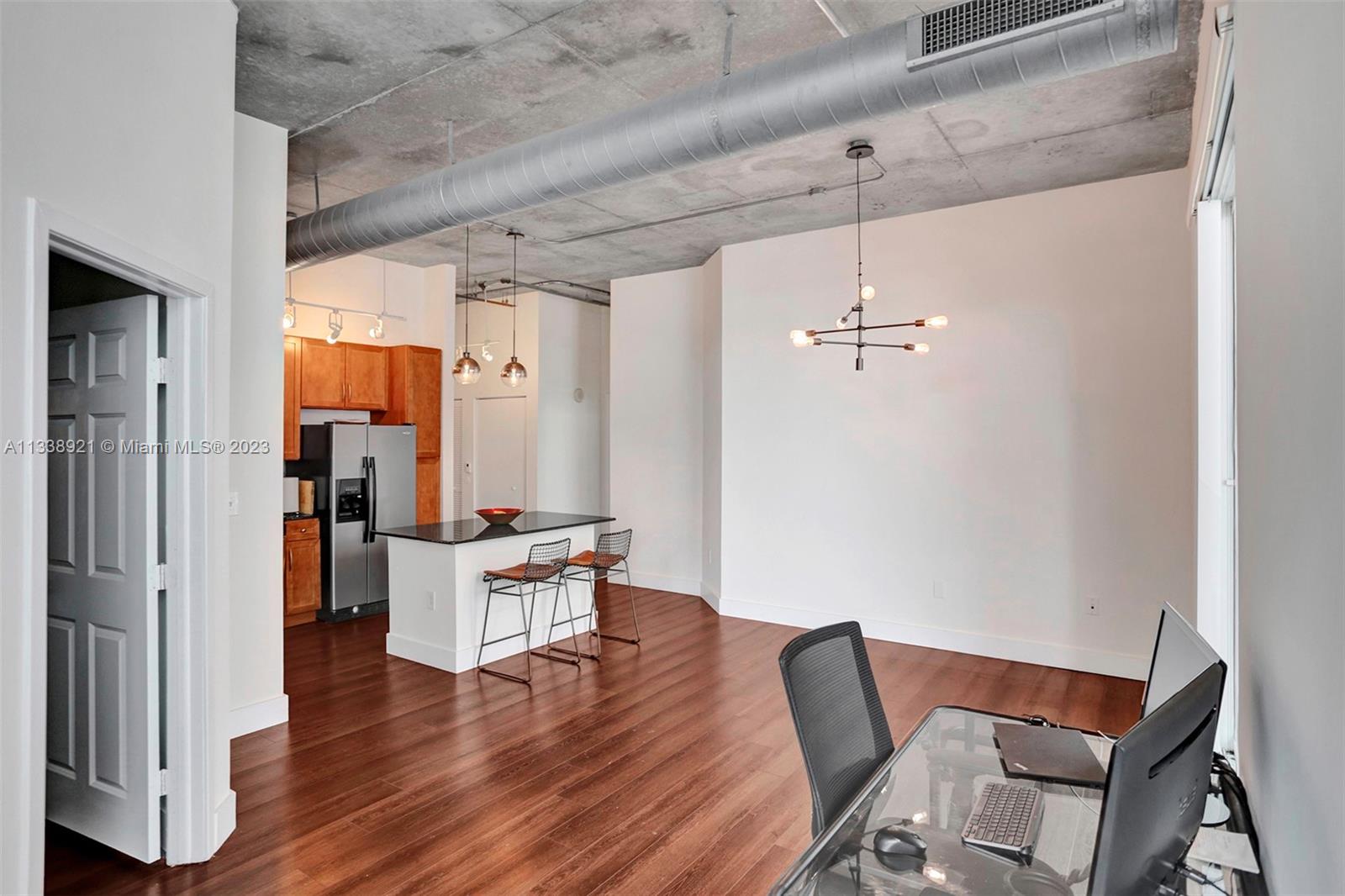 2001 Biscayne Boulevard, Unit 2202 Miami, FL 33137 - Photo 3 of 31 a living room with furniture and wooden floor
