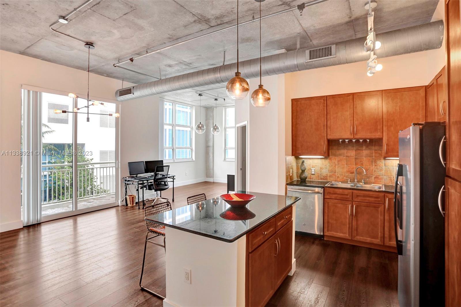 2001 Biscayne Boulevard, Unit 2202 Miami, FL 33137 - Photo 9 of 31 a open kitchen with stainless steel appliances granite countertop a stove and refrigerator