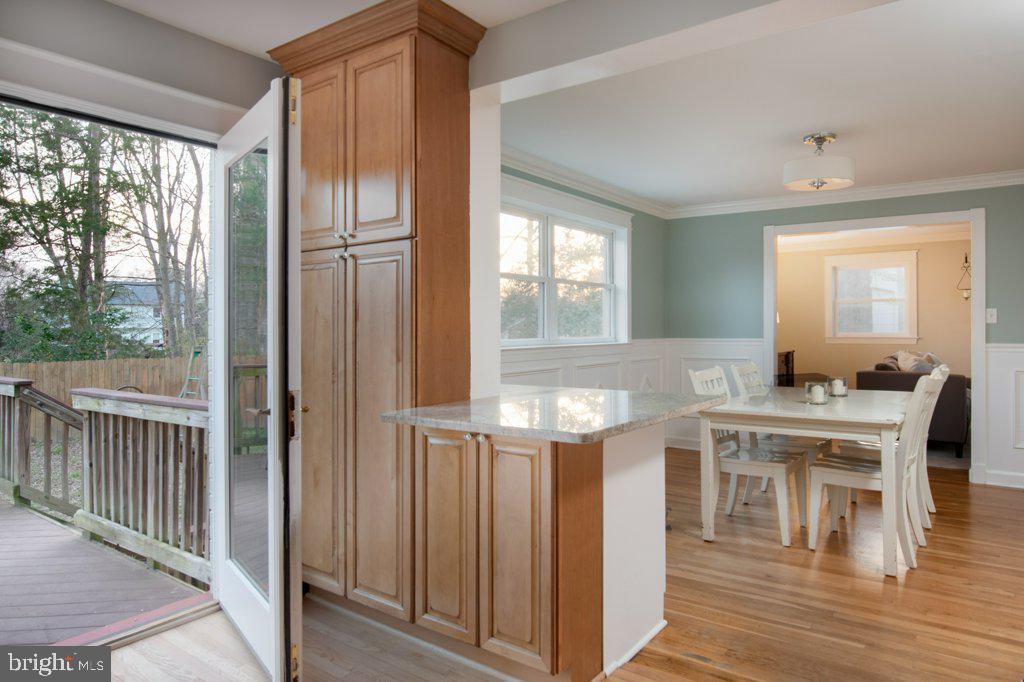1203 Collingwood Road Alexandria, VA 22308 - Photo 13 of 51 Kitchen opens to dining room and back deck.