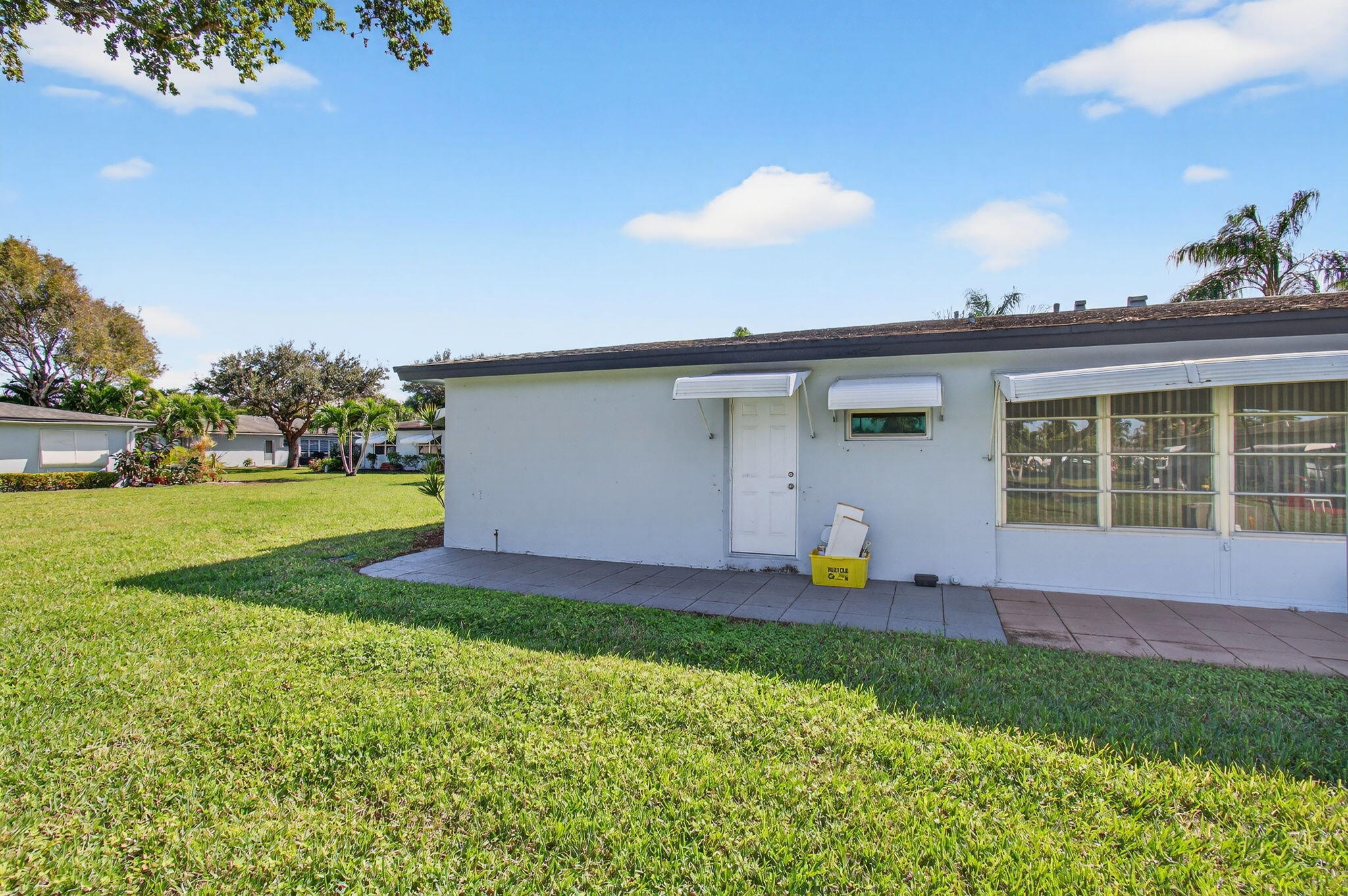 417 High Point Boulevard, Unit D Delray Beach, FL 33445 - Photo 33 of 51 Exterior back yard patio and view (2)