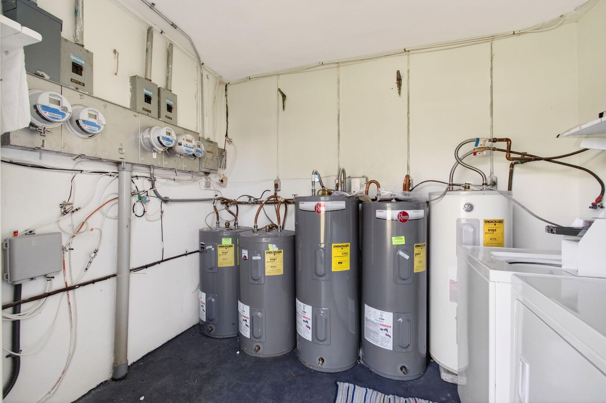417 High Point Boulevard, Unit D Delray Beach, FL 33445 - Photo 35 of 51 Water tanks and laundry room (1)