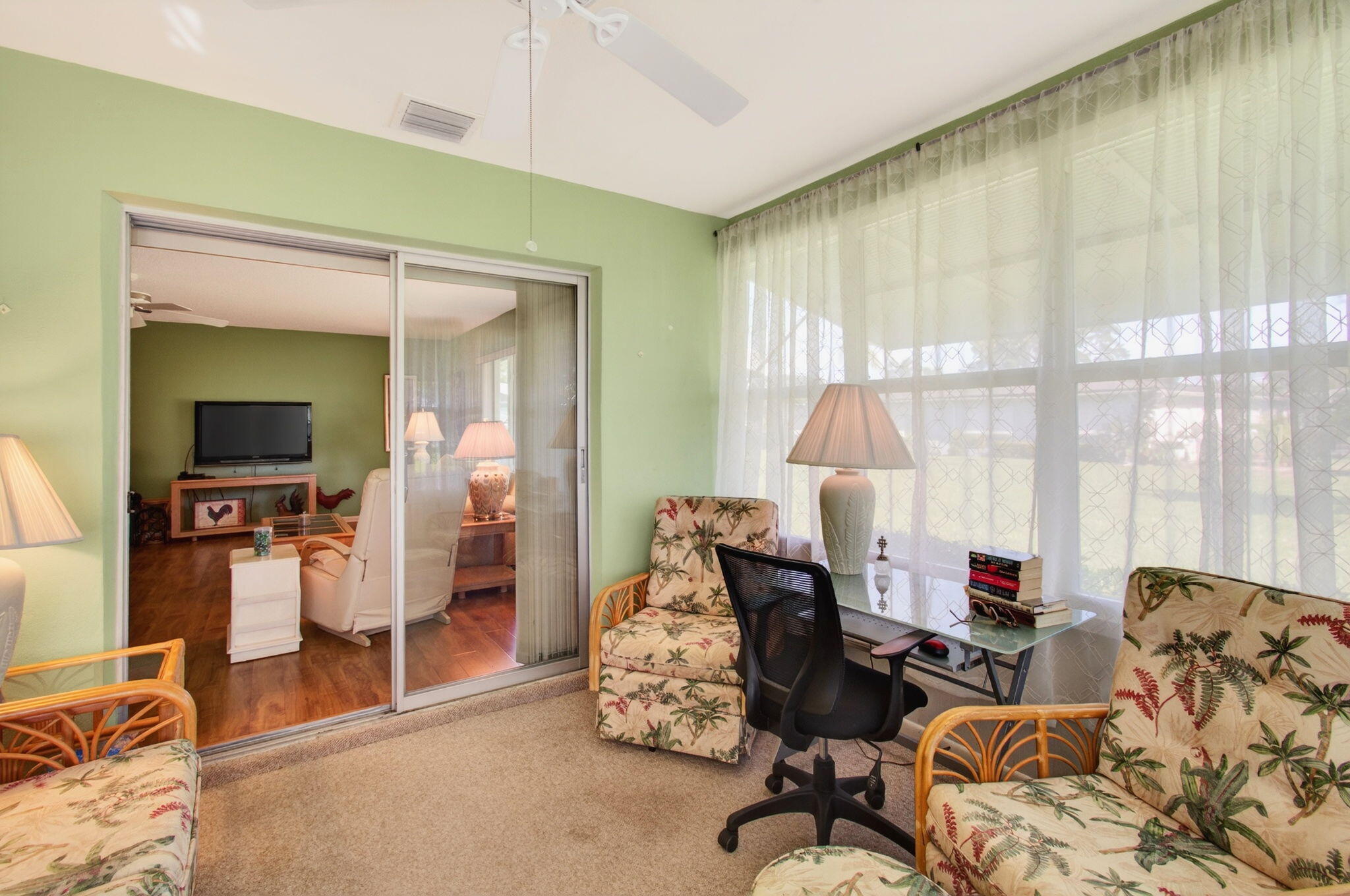 417 High Point Boulevard, Unit D Delray Beach, FL 33445 - Photo 5 of 51 Enclosed Florida room under air (1)