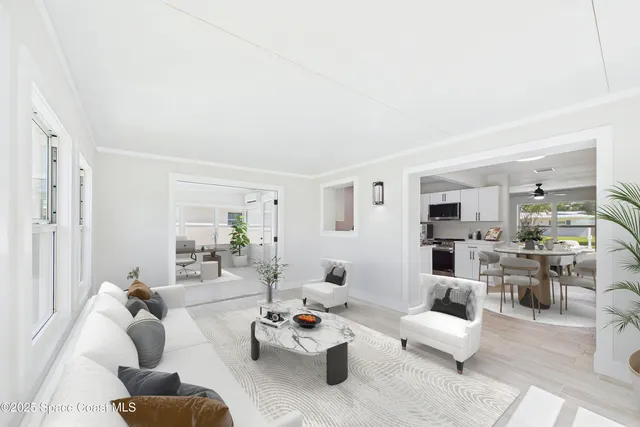 a living room with furniture and a table