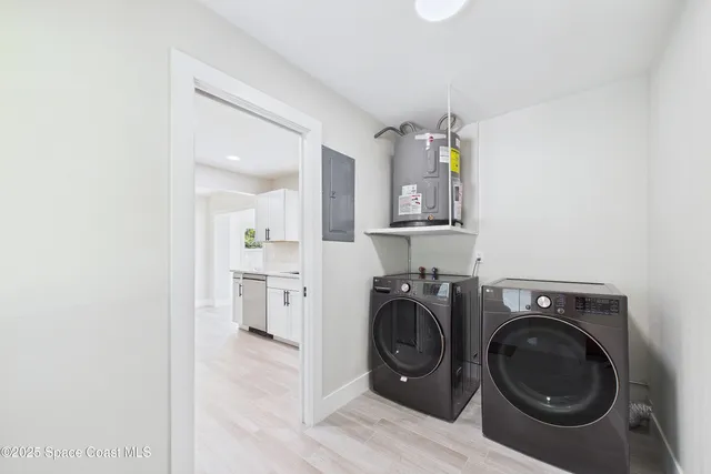 a view of a kitchen with stainless steel appliances cabinets and a window