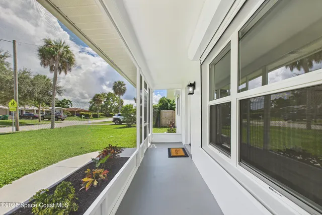 a balcony with view of swimming pool