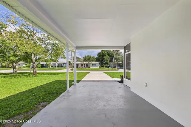 a view of a park with large trees