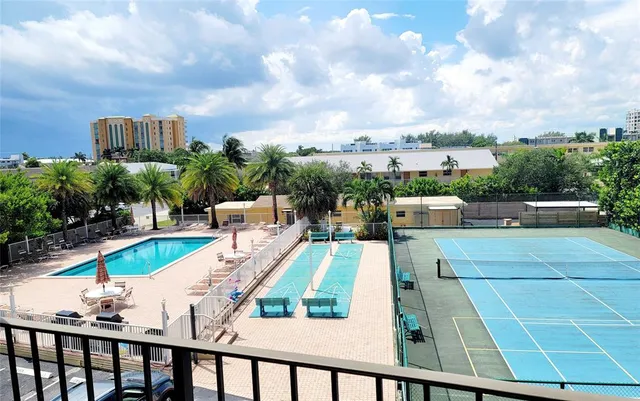 a view of a swimming pool with a patio