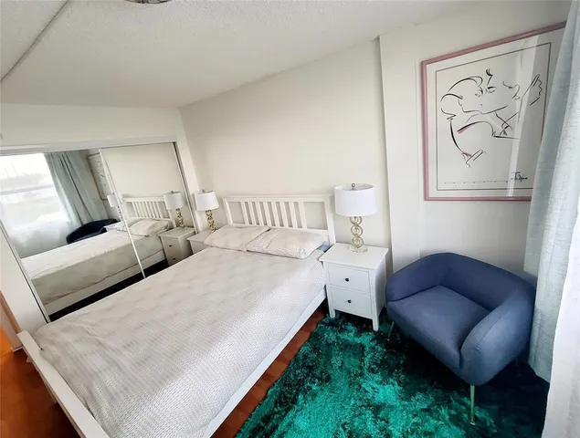 a living room with furniture and a lamp