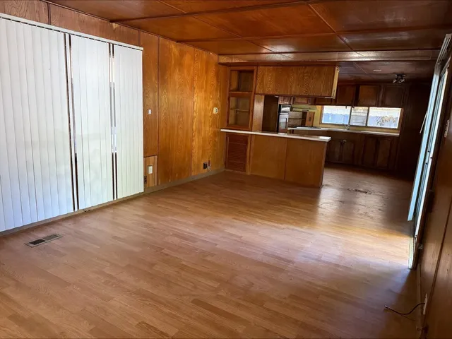 a view of a kitchen with wooden floor