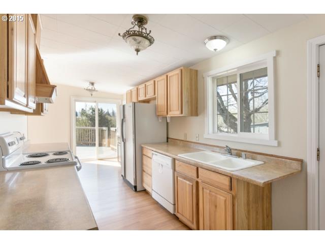 1531 Checketts Road Hood River, OR 97031 - Photo 5 of 16 a kitchen with a sink stove and refrigerator