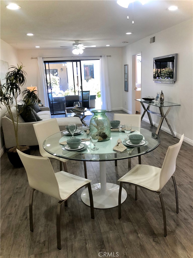 24339 Pasto Road, Unit A Dana Point, CA 92629 - Photo 1 of 28 a view of a dining room with furniture and wooden floor