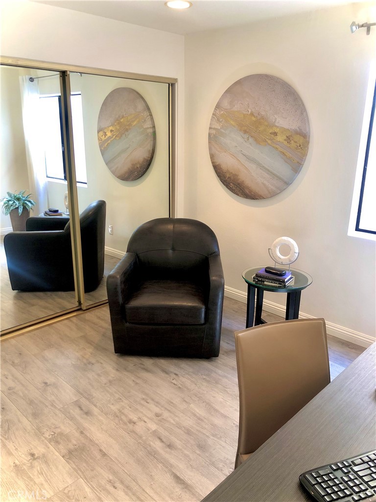 24339 Pasto Road, Unit A Dana Point, CA 92629 - Photo 14 of 28 a living room with furniture and a mirror