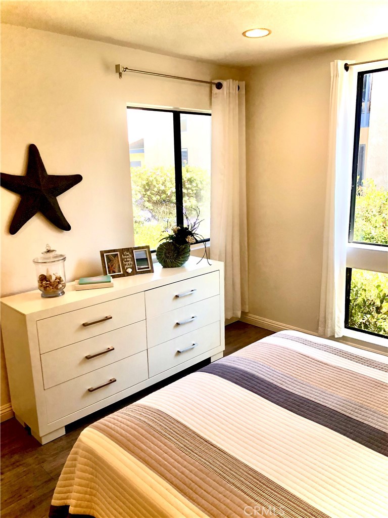 24339 Pasto Road, Unit A Dana Point, CA 92629 - Photo 16 of 28 a bedroom with a bed and a window