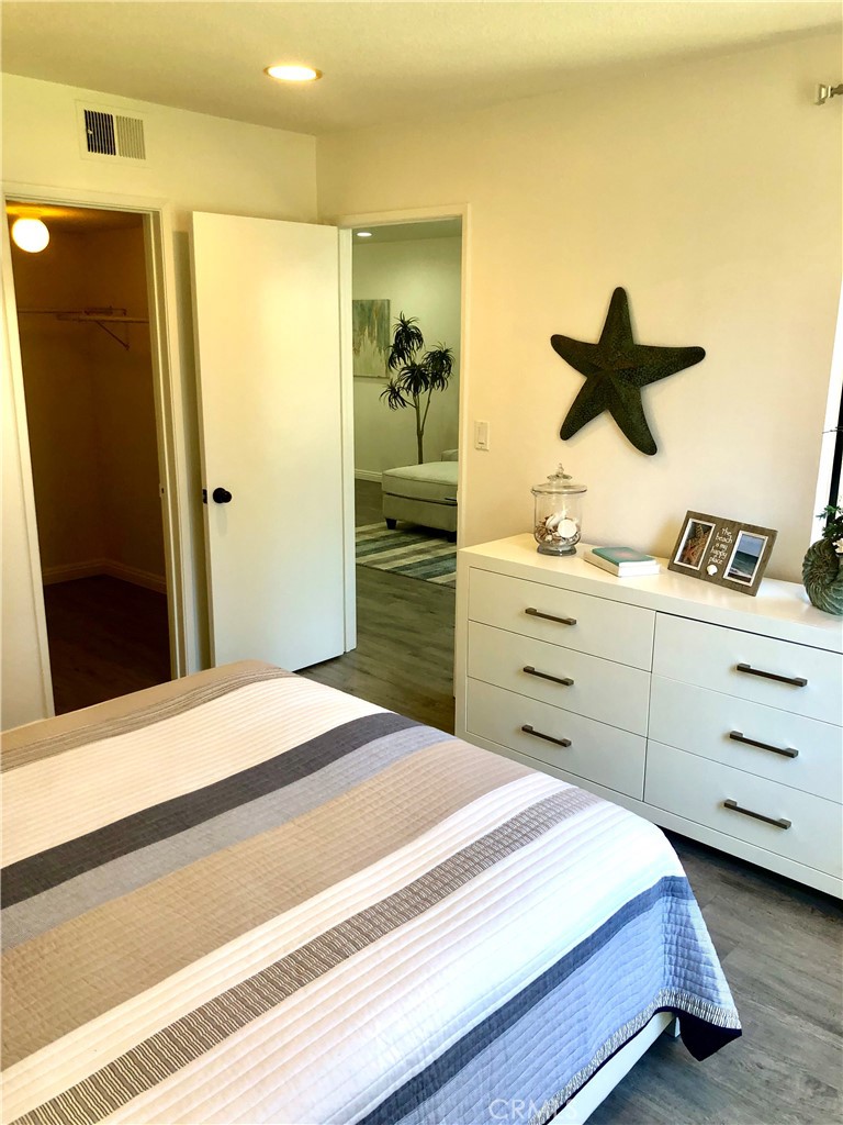 24339 Pasto Road, Unit A Dana Point, CA 92629 - Photo 18 of 28 a bedroom with a bed and a dresser