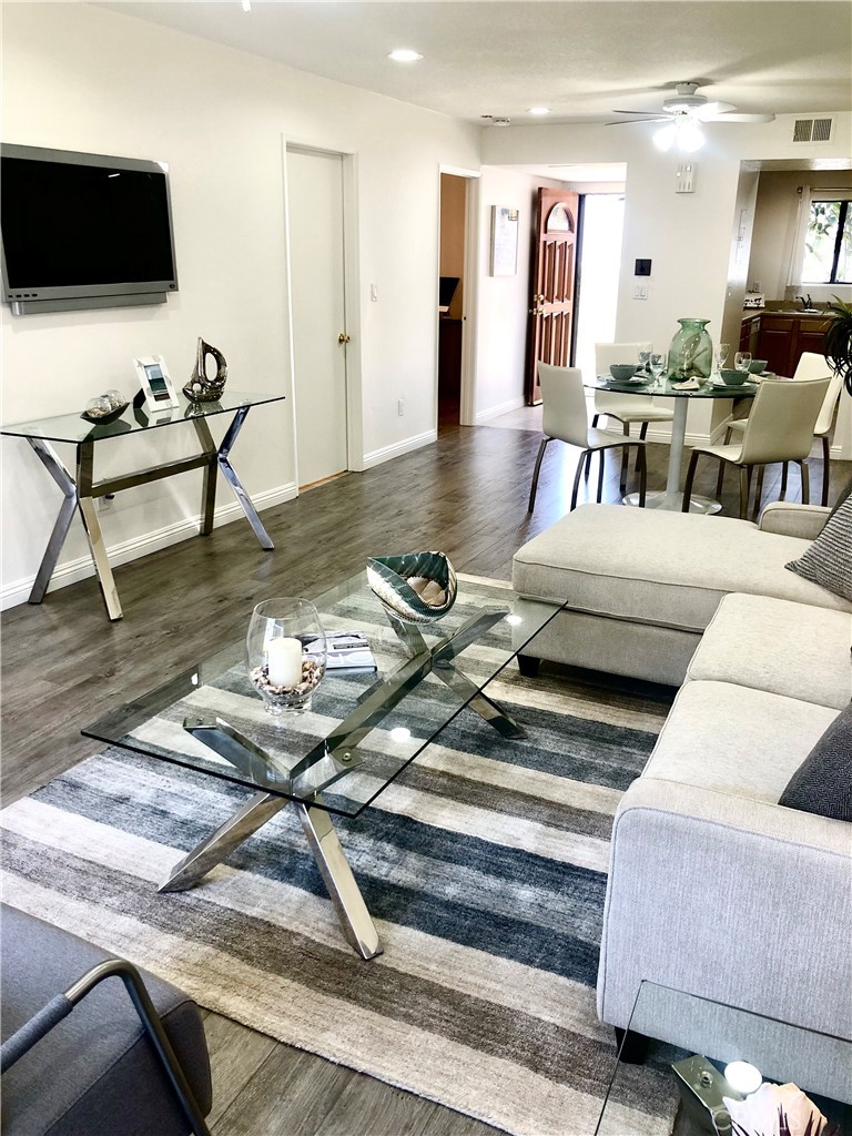 24339 Pasto Road, Unit A Dana Point, CA 92629 - Photo 2 of 28 a living room with furniture and a flat screen tv