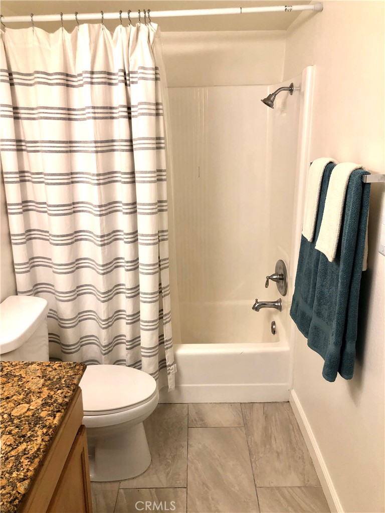 24339 Pasto Road, Unit A Dana Point, CA 92629 - Photo 23 of 28 a bathroom with a toilet and a bathtub
