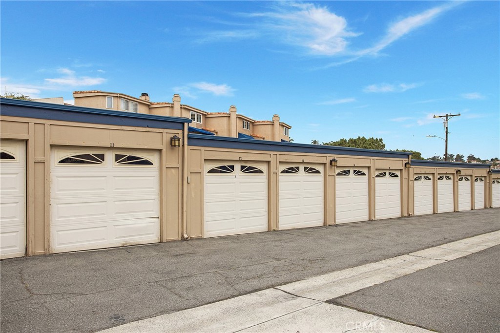 24339 Pasto Road, Unit A Dana Point, CA 92629 - Photo 26 of 28 a view of a house with a garage