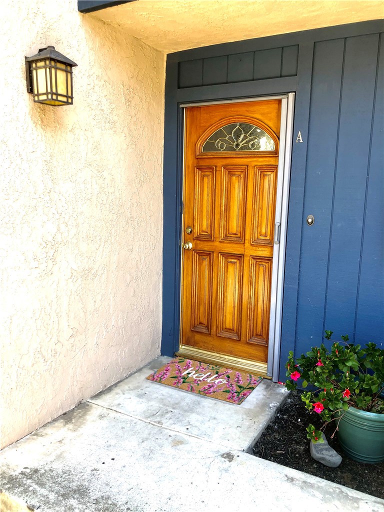 24339 Pasto Road, Unit A Dana Point, CA 92629 - Photo 28 of 28 a view of front door with a bench
