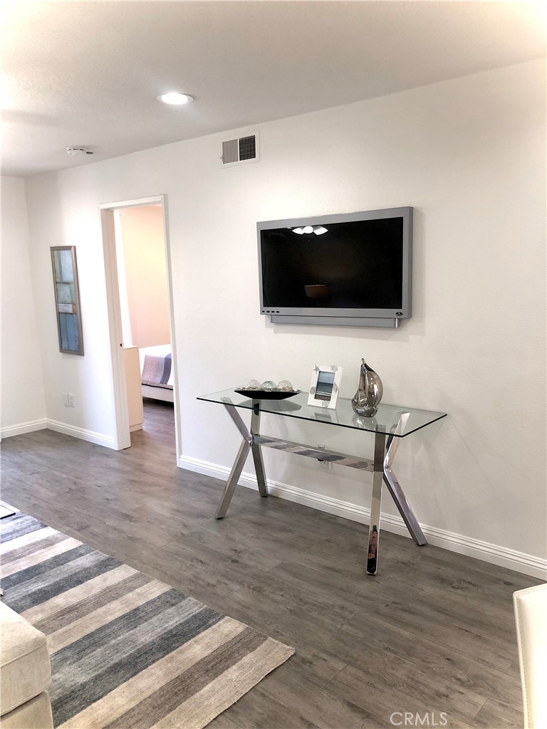 24339 Pasto Road, Unit A Dana Point, CA 92629 - Photo 4 of 28 a living room with furniture and a flat screen tv