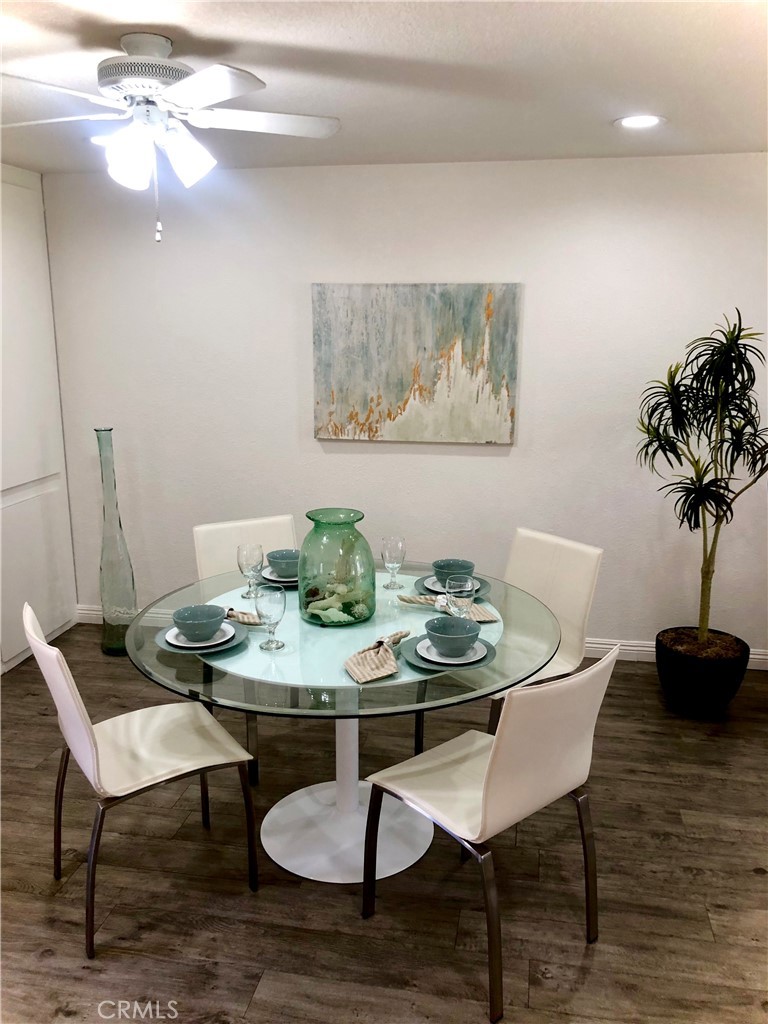 24339 Pasto Road, Unit A Dana Point, CA 92629 - Photo 7 of 28 a view of a dining room with furniture and wooden floor