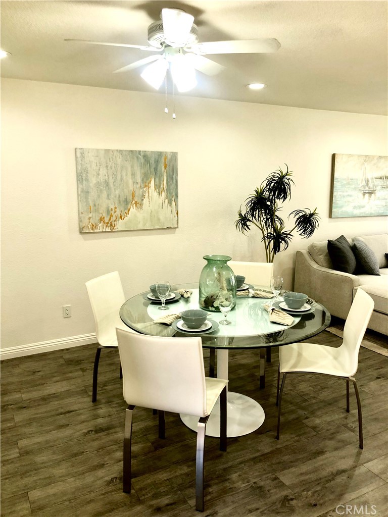 24339 Pasto Road, Unit A Dana Point, CA 92629 - Photo 8 of 28 a view of a dining room with furniture and wooden floor