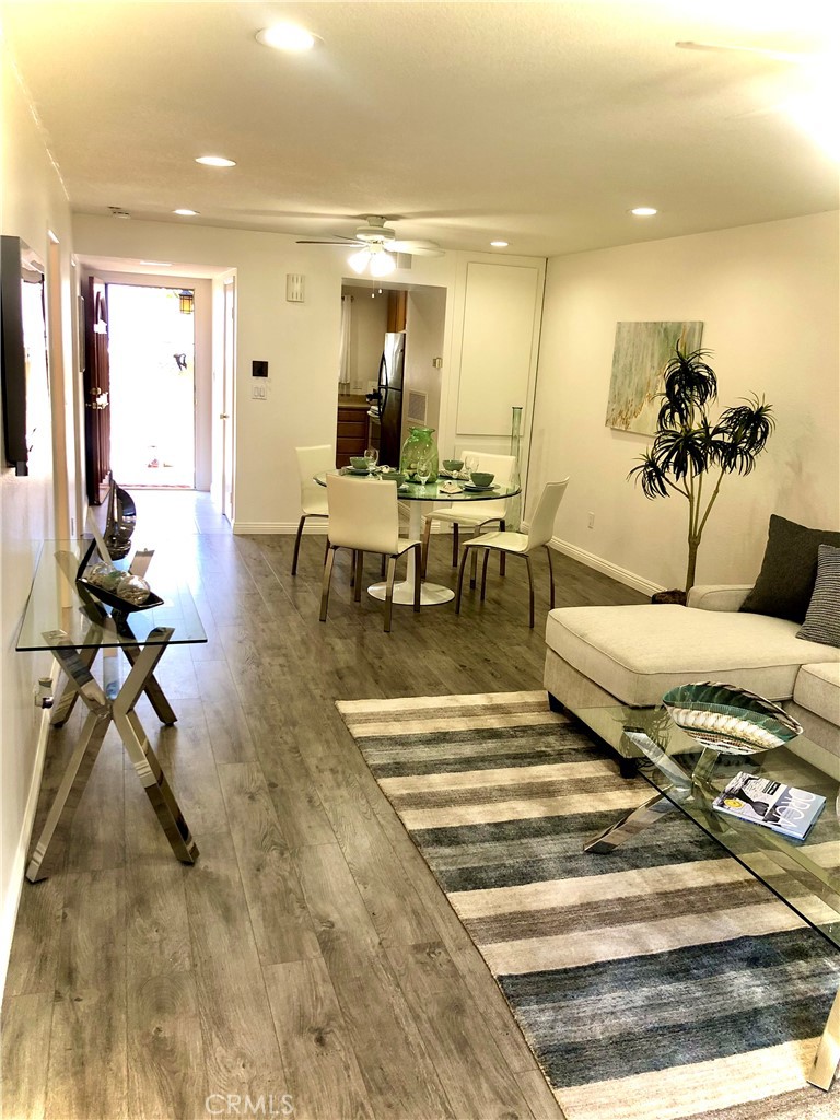24339 Pasto Road, Unit A Dana Point, CA 92629 - Photo 9 of 28 a living room with furniture a rug and white walls