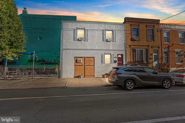 a car parked in front of a house