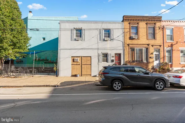 a car parked in front of a house
