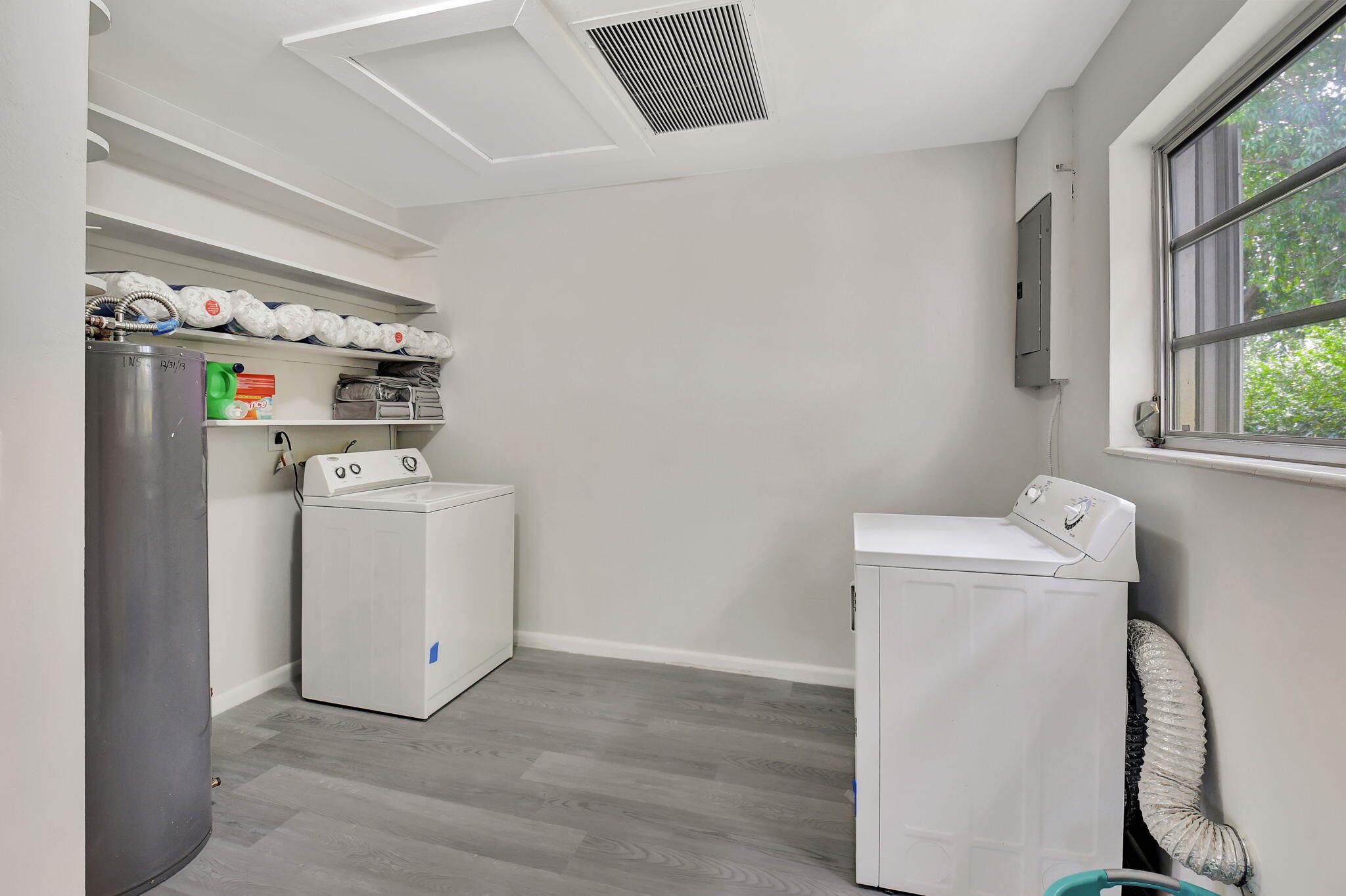 410 Spanish River Boulevard Boca Raton, FL 33431 - Photo 12 of 26 a utility room with dryer and washer