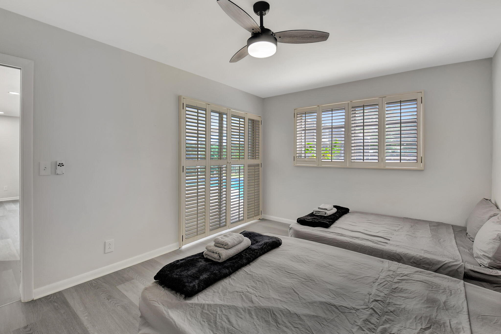 410 Spanish River Boulevard Boca Raton, FL 33431 - Photo 13 of 26 a bed room with a bed and a window