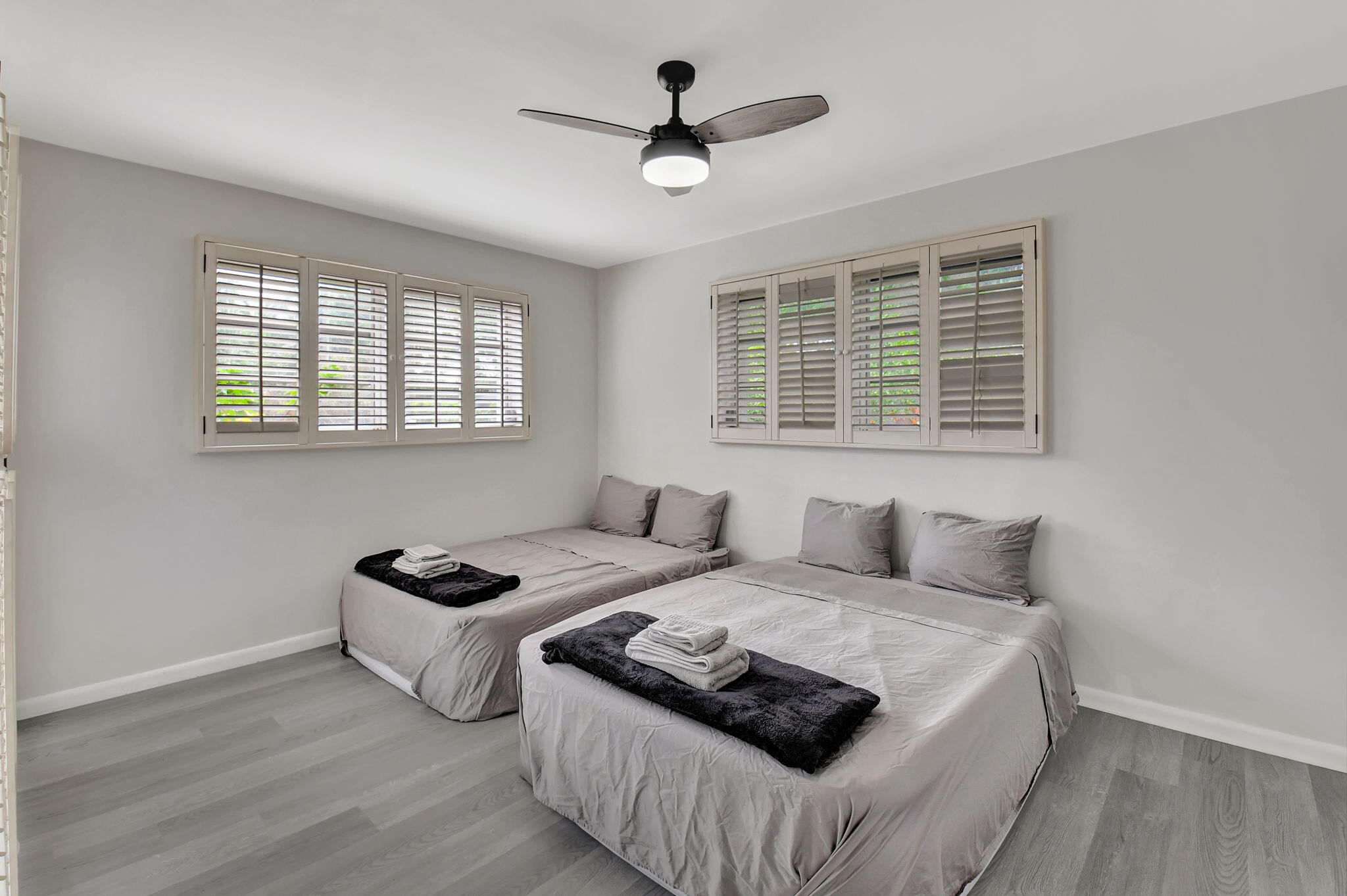 410 Spanish River Boulevard Boca Raton, FL 33431 - Photo 14 of 26 a bedroom with a bed and a window