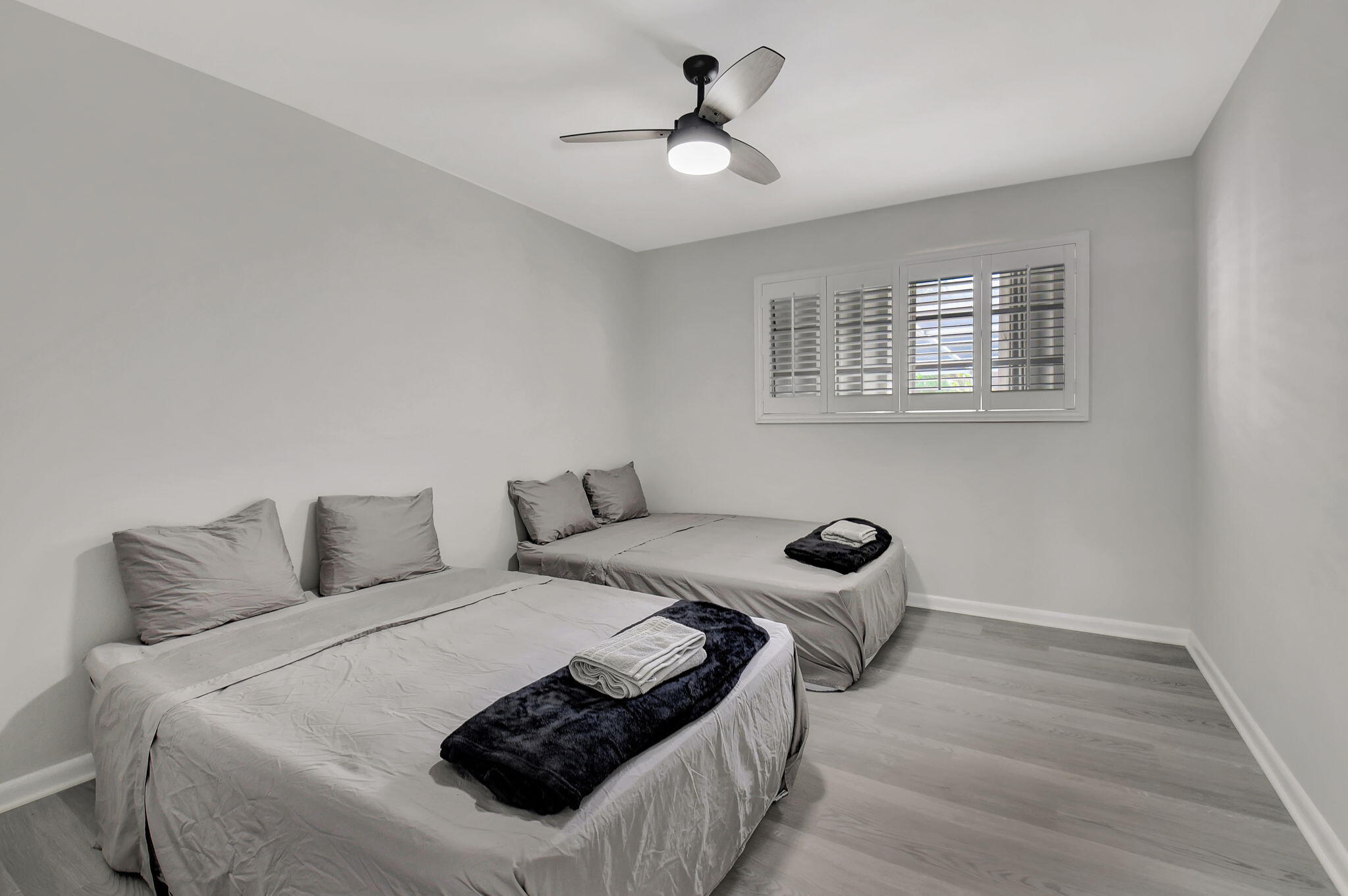 410 Spanish River Boulevard Boca Raton, FL 33431 - Photo 18 of 26 a bedroom with a bed and a ceiling fan