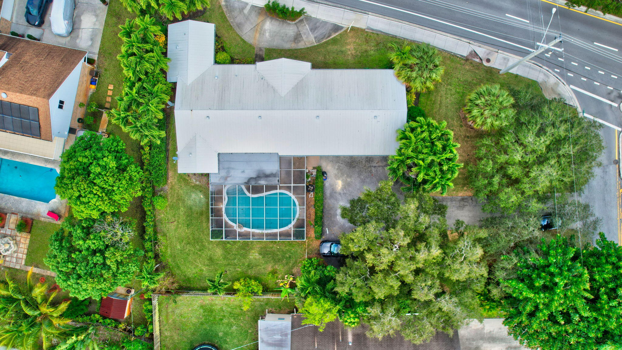 410 Spanish River Boulevard Boca Raton, FL 33431 - Photo 22 of 26 an aerial view of a house with a yard and garden