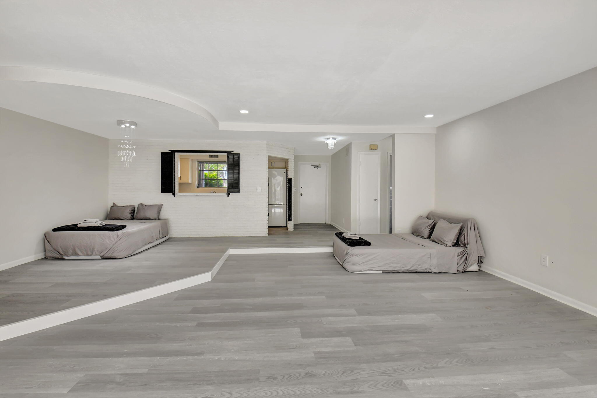 410 Spanish River Boulevard Boca Raton, FL 33431 - Photo 5 of 26 a living room with furniture and white walls