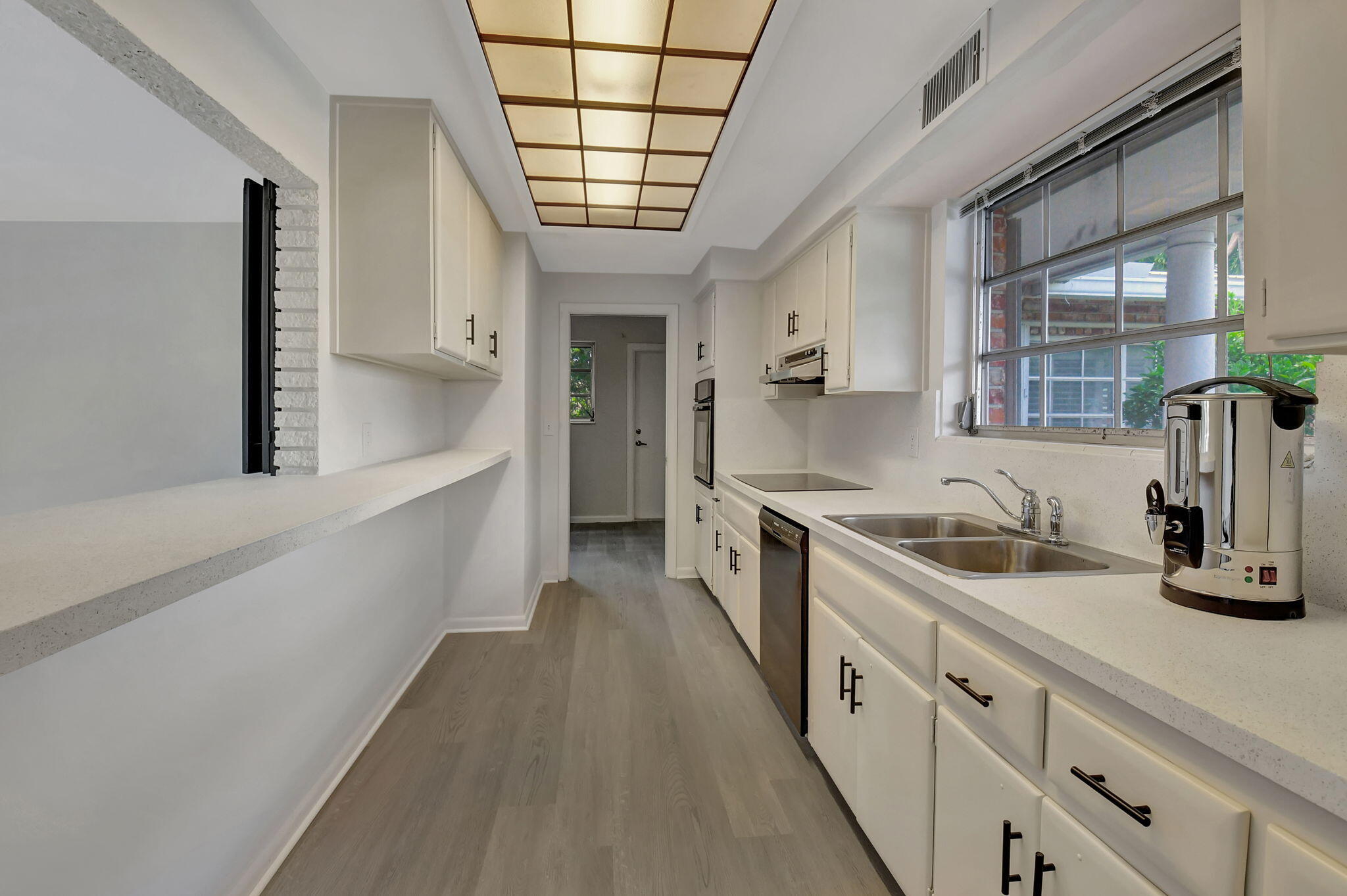 410 Spanish River Boulevard Boca Raton, FL 33431 - Photo 10 of 26 a large kitchen with a lot of counter space