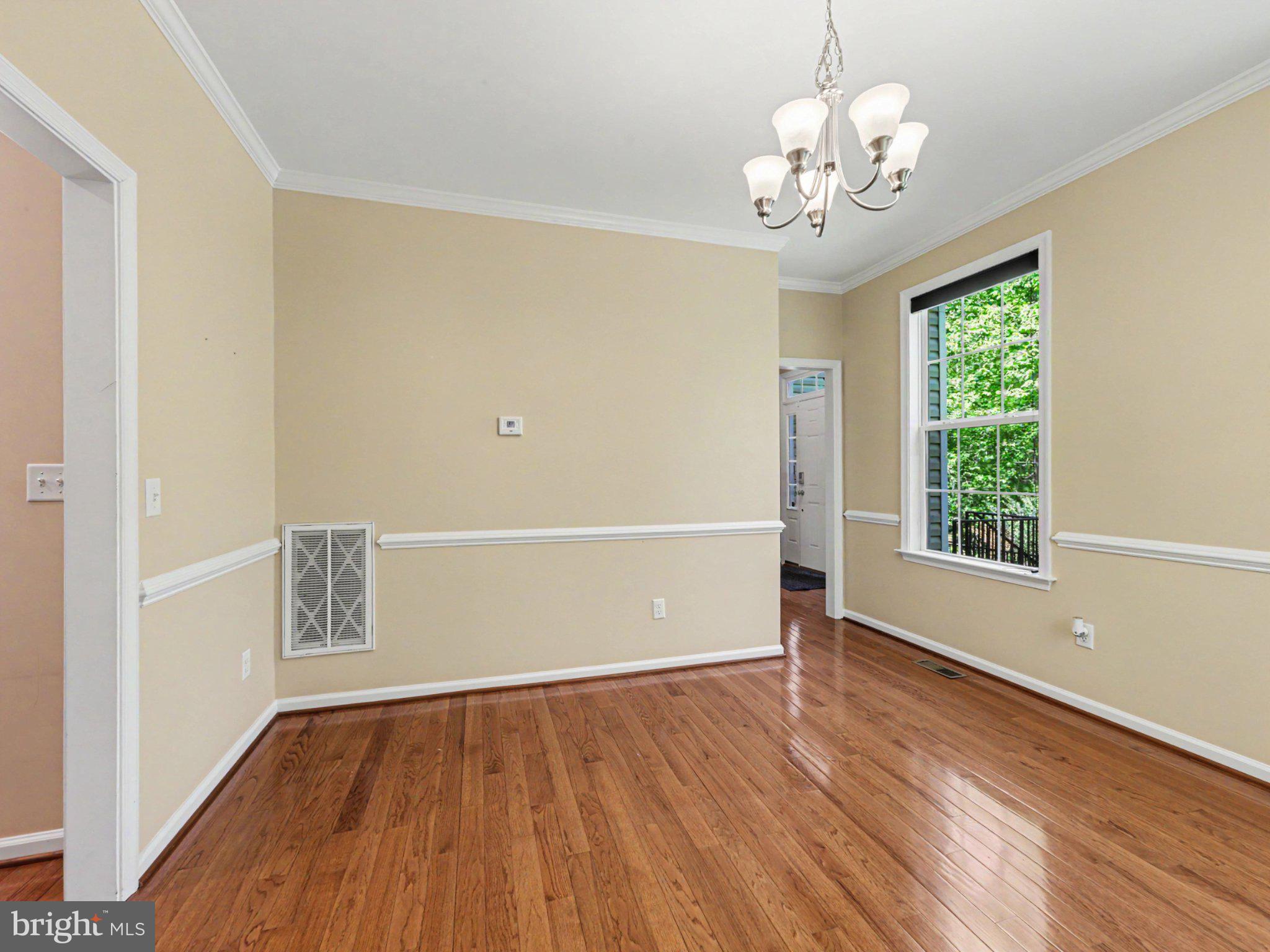 9811 Catharpin Road Spotsylvania, VA 22551 - Photo 11 of 30 a view of an empty room with wooden floor and a window