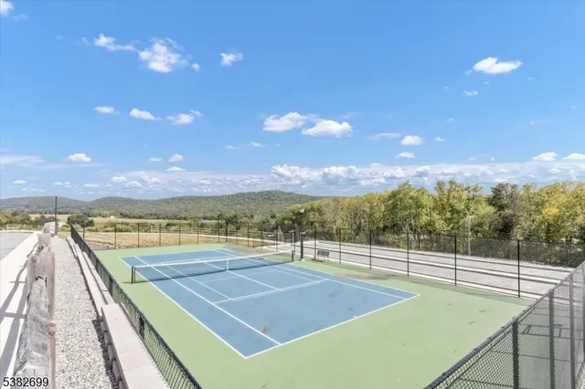 a view of an outdoor space and tennis court