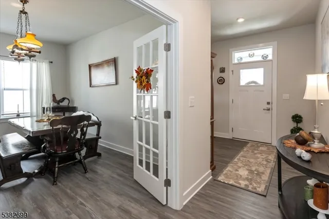 a view of a livingroom with furniture and hardwood floor