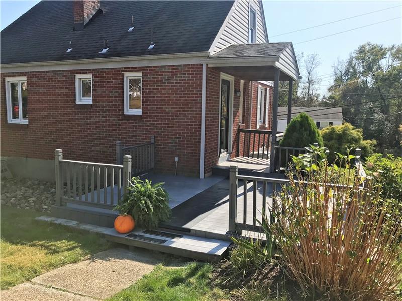 The covered side entrance is just off the deck that leads to the back yard.