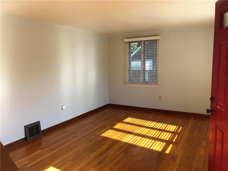 198 Seavey Road Pittsburgh, PA 15223 - Photo 11 of 18 The spacious Living Room with the hard wood floors found through most of the home.