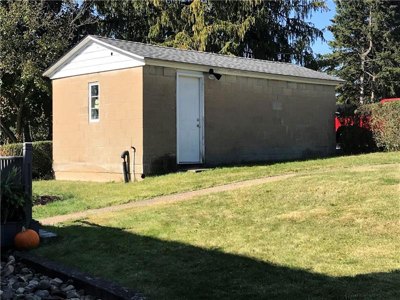 A one car garage is accessed from the alley behind the house.