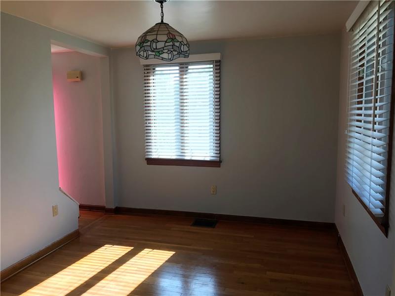 198 Seavey Road Pittsburgh, PA 15223 - Photo 8 of 18 The Dining Room leads to the Entry and Living Room on the left.