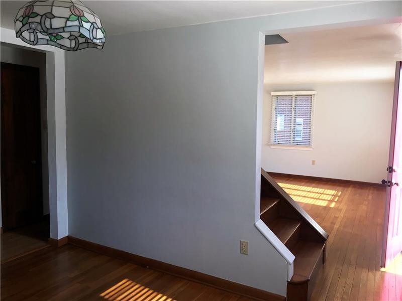 198 Seavey Road Pittsburgh, PA 15223 - Photo 9 of 18 A view of the stairs to the upper level and the Living Room.