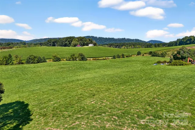 a view of lake with mountain in the background