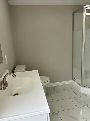 a bathroom with a sink and toilet