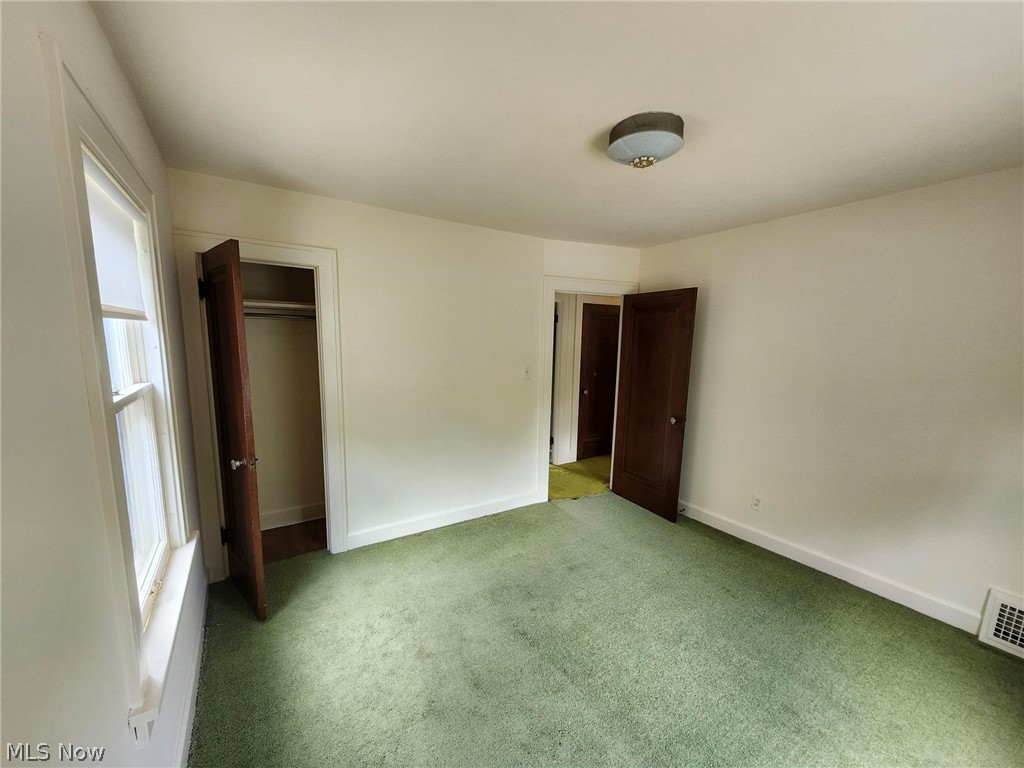 3819 Woodridge Road Cleveland Heights, OH 44121 - Photo 23 of 42 Unfurnished bedroom with dark colored carpet and a closet
