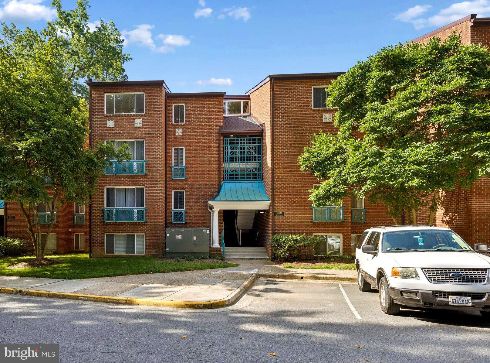11841 Shire Court, Unit 31D Reston, VA 20191 - Photo 1 of 24 a car parked in front of a house