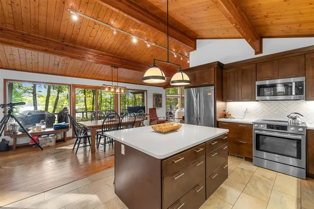 a kitchen with a stove and a refrigerator