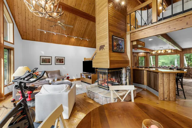 a view of a patio with chairs and potted plants