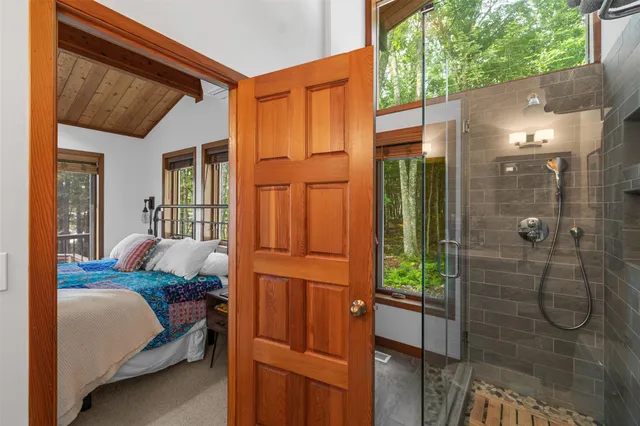 a bed room with a bed and a window